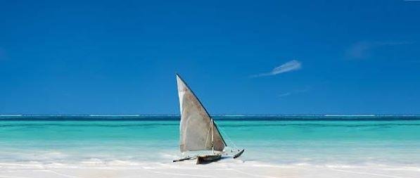 Dhow on a white-sand Zanzibar beach